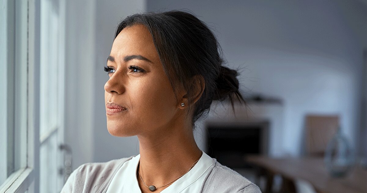 Thoughtful woman learning the warning signs of an incomplete abortion and when to seek medical care.